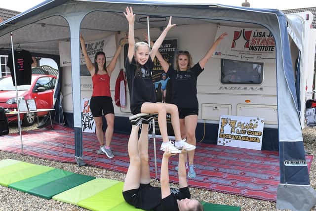Members of the Lisa Jay Stage Institute raising money to save their school.