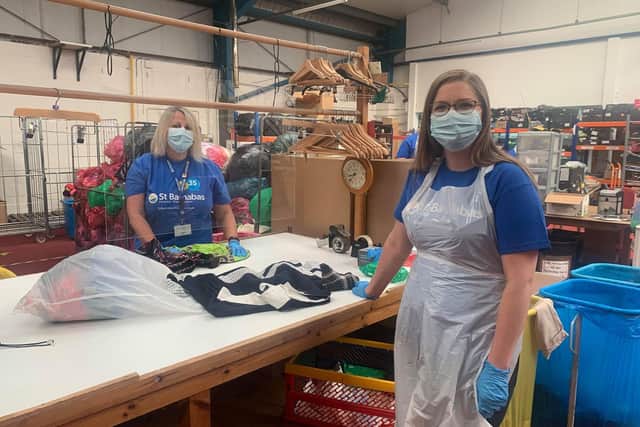 Sorting bags at the St Barnabas Hospice warehouse after the drive-thru donation scheme. EMN-200716-131130001