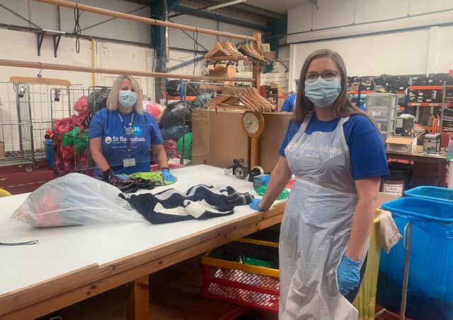 Sorting bags at the St Barnabas Hospice warehouse after the drive-thru donation scheme. EMN-200716-131130001