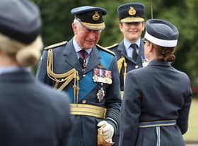 Congratulating a graduate on parade at RAF College Cranwell - Prince Charles as reviewing officer.