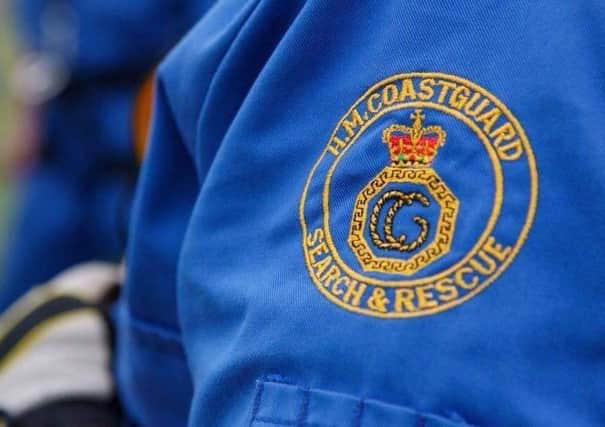 Dial 999 and ask for the coastguard in a coastal emergency.