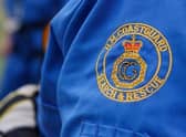 Dial 999 and ask for the coastguard in a coastal emergency.