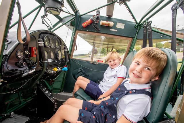 High flyers Theo Grinstead, four,  and Ollie Grinstead, six, in original MK5 Auster served in Holland 1944 at the Lincolnshire Aviation Heritage Centre..