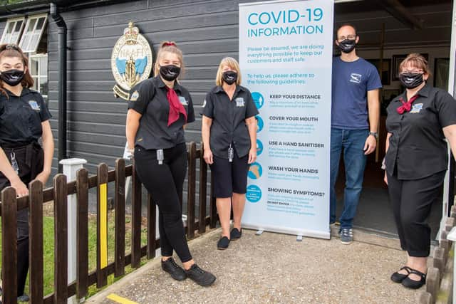 Staff outside the new Hampdon exhibition display at the Lincolnshire Aviation Heritage Centre.