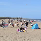Visitors flocked to the beach in Skegness at the weekend in spite of the Which? survey rating it the worst resort of 100 around the country.