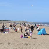 Visitors flocked to the beach in Skegness at the weekend in spite of the Which? survey rating it the worst resort of 100 around the country.