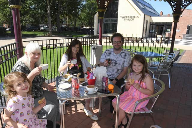 Enjoying some refreshments  in the bandstand in front of Cafe Dansant, are (from left)  Alanna Roberts, 4, Susan Boyce, June Roberts, Gavin Roberts, and Alissa Roberts, 8.