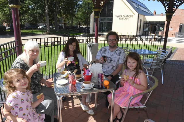 Enjoying some refreshments in the bandstand in front of Cafe Dansant, are (from left) Alanna Roberts, 4, Susan Boyce, June Roberts, Gavin Roberts, and Alissa Roberts, 8.