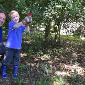 Five-year-old Alexander Lunn busy pruning with his dad Jonathan. Picture John Edwards