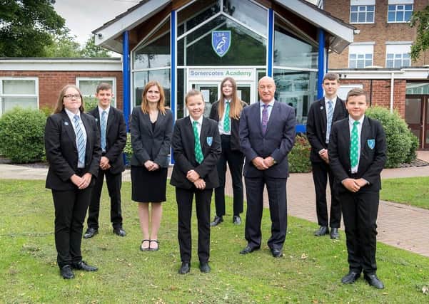 Somercotes Academy Principal Frances Green, alongside CEO of Tollbar Multi Academy Trust David Hampson, and several students. (Picture: Sean Spencer/Hull News & Pictures Ltd.)