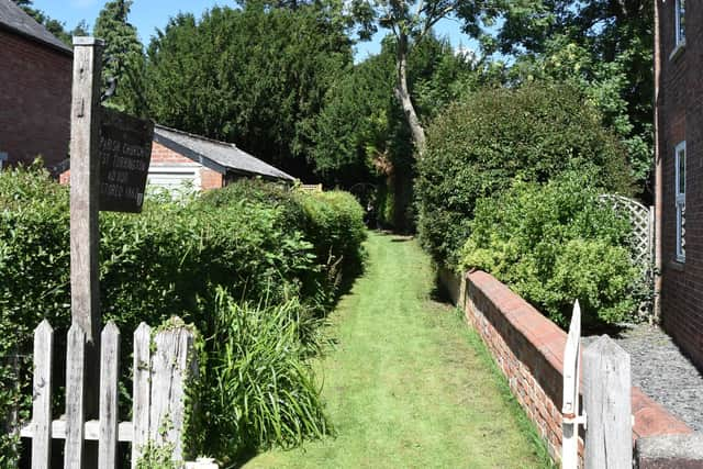 The church is set back from the road, with access via a public footpath.  Picture John Edwards