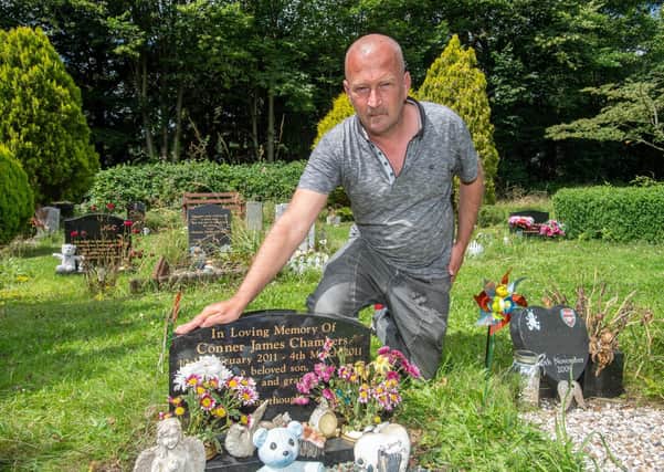 Darren Chambers at his son's grave.