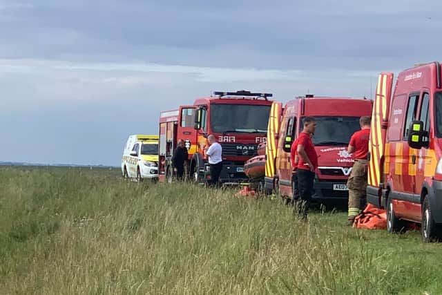 Specialist fire and rescue crews tool up to free the stranded cow.
