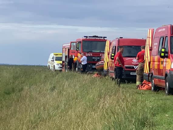 Specialist fire and rescue crews tool up to free the stranded cow.