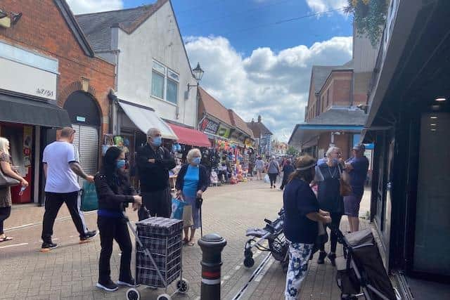 Shoppers queuing in masks outside Kirk's Butchers in High Street.
