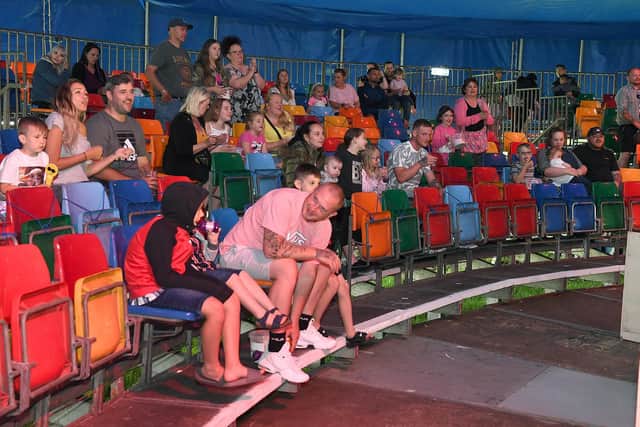 Audience enjoy the acts in the circus, which is also being used for live entainment