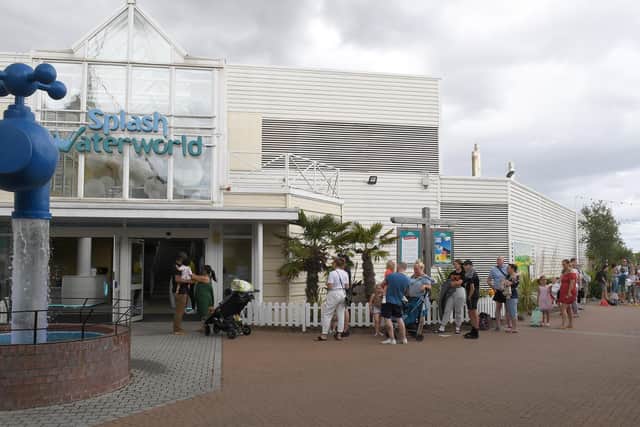 Visitors queuing for the swimming pool which they can boon on a new app.
