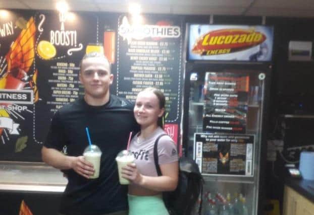 Caleb Law and Chloe Russel enjoying smoothies at the new juice bar at Phoenix Fitness..