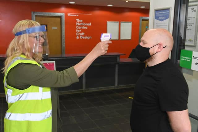 NCCD re-opens to the public. Director, Clare Edwards testing the temperature of Mark Bowery. EMN-200727-100511001