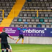 Substitutes Frank Mulhern and Dominic Knowles join in the celebrations.Photo: @RussellDossett (www.sportspictures.online)