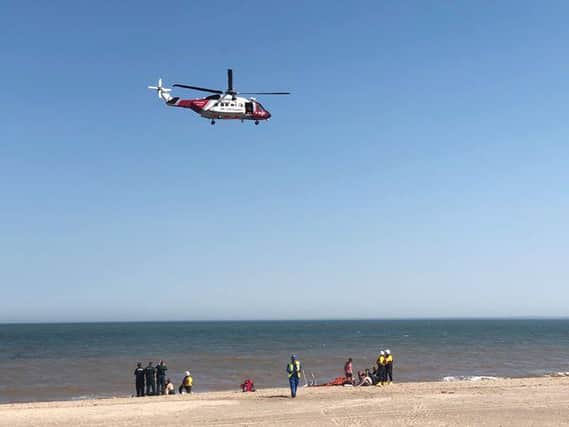 The air ambulance arriving at Skegness beach to take two casualties to hospital.