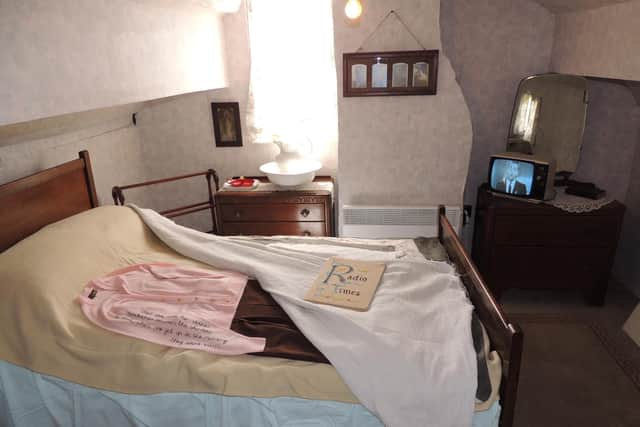 Mrs Smith's bedroom. She used to warm up her clothes with the heat from the bed in the morning.