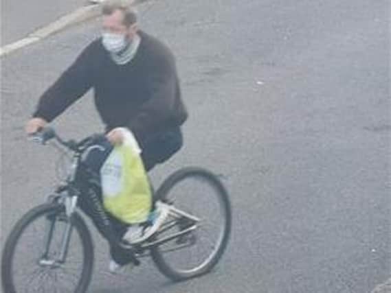 Do you know this masked man relating to a bike theft in Haconby?