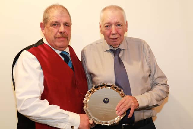Caistor Cricket Club chairman Ben Jacob presented Wes Allison with a special award for 57 years service to the club. Picture: Gareth Johnson EMN-200508-092745001