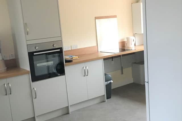 The kitchen area of one of the new homes with wide open plan areas to enable easy manoeuvring in a wheelchair and easy low level access work tops. EMN-201008-141342001