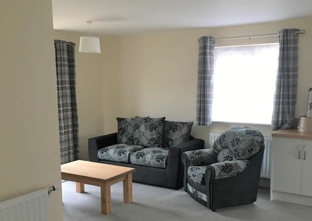 The lounge area of one of the new homes with wide open plan areas to enable easy manoeuvring in a wheelchair and easy low level access work tops. EMN-201008-141313001