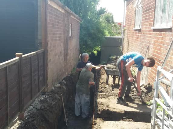 Volunteers digging the footings for the extension to the Spilsby Christian Fellowship church.
