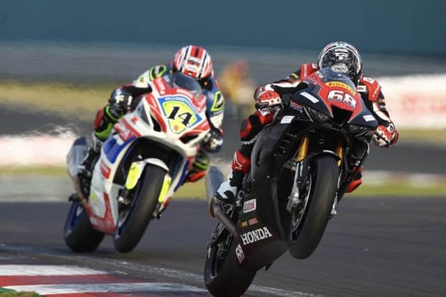 Tom Neave (68) does battle with brother Tim at Donington Park. Photo: Dave Yeomans.