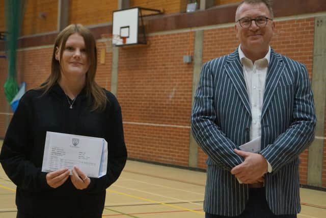 Head teacher Simon Porter with Ellyse Gilliot who has secured an apprenticeship in Nursing at Lincoln Hospital with her B B and Distriction grades EMN-200813-110540001