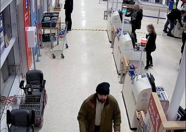 Undated handout photo issued by Hertfordshire Constabulary of Nigel Wright, 45, in a Tesco store in Lockerbie where he is accused of planting a jar of Heinz baby food laced with fragments of a craft knife as part of a plot to blackmail the supermarket chain for ??1.4 million in bitcoin. A mother "felt sick" when she realised she had been millimetres away from feeding her 10-month-old son part of the craft knife allegedly planted in the jar, a court has heard. EMN-200814-133422001