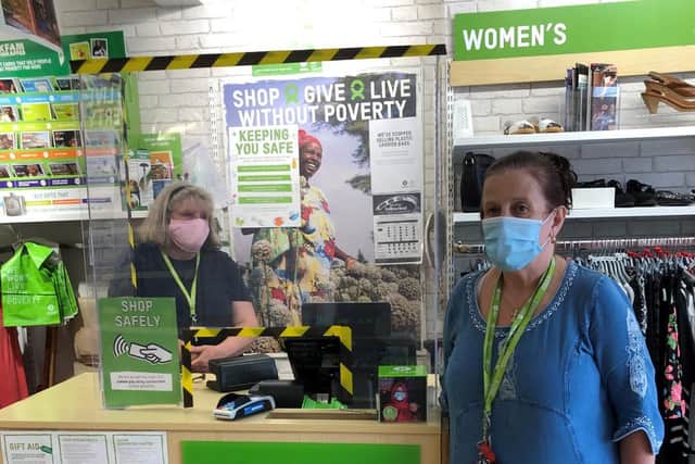 Returning volunteer Helen Housley (left) and Oxfam shop manager Sue
Ray (right) say 'thank you' for all the generous donations from the Skegness
community.