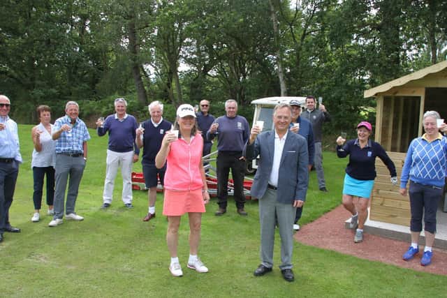Elsham Golf Club President John Harris and Project Co-ordinator Sarah Harris celebrates the opening of the club’s new driving range with the committee members who made the development possible.