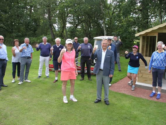 Elsham Golf Club President John Harris and Project Co-ordinator Sarah Harris celebrates the opening of the club’s new driving range with the committee members who made the development possible.