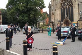The two minute silence is held for VJ Day in Sleaford Market Place on Saturday. EMN-200817-154654001