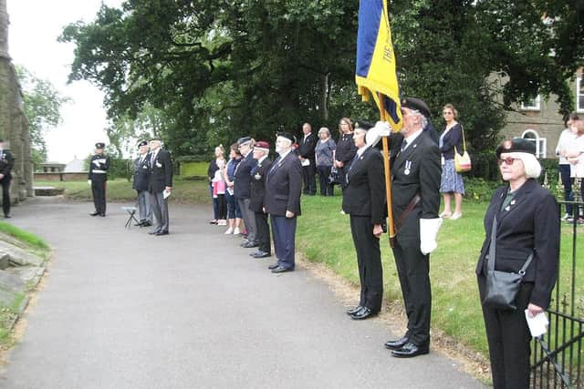 The parade with standard bearer Michael Lenton and escorts Ann Lenton and Barbara Chandler.