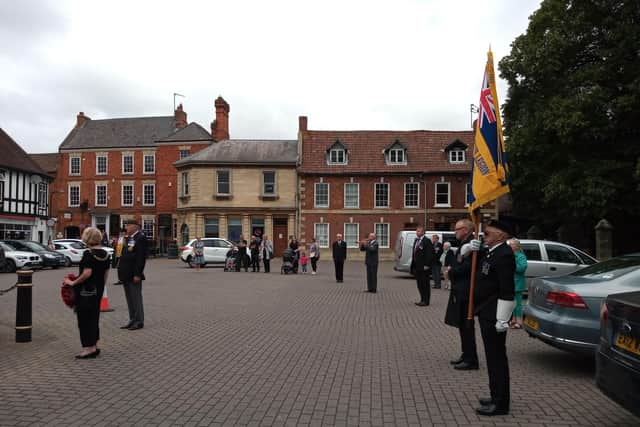 The small gathering of British Legion members and onlookers on VJ Day in Sleaford. EMN-200817-154706001