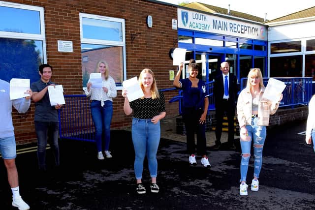 Socially-distanced GCSE students celebrate at Louth Academy today with Martin Brown, Executive Principal. EMN-200820-122718001