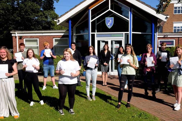 GCSE students celebrate outside Somercotes Academy today with Principal Frances Green. EMN-200820-124425001