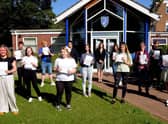 GCSE students celebrate outside Somercotes Academy today with Principal Frances Green. EMN-200820-124425001