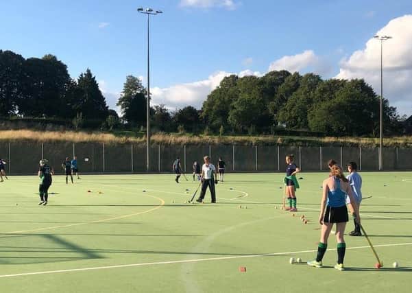 Louth Hockey Club celebrates £5,000 donation towards new artificial pitch.