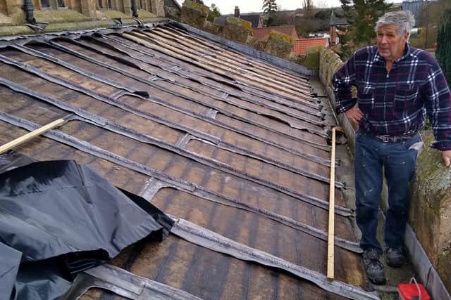 Fr. Neil Knox, Interim Priest in Charge in the Billingborough Group, churchwarden Geoff Hallam and Fundraising Lead Trevor Wells grabbed a hammer apiece and installed some temporary plastic sheeting after the lead theft last year. They later replaced it with roofing felt. EMN-200821-155558001