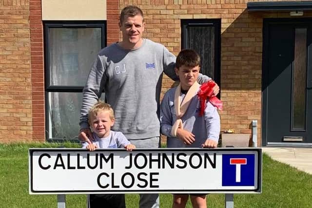 Callum with the new sign