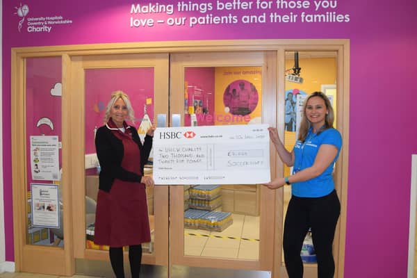 NHS nurse receiving the Soccersixes cheque for £2,025.