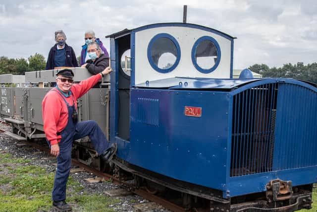 The scene recreated on  August 27, 2020, at the LCLR’s current base in the Skegness Water Leisure Park. Driver Mick Allen (a volunteer since August 29, 1960, with original locomotive ‘Paul’ and volunteers Claire Smith, Gina Roberts and Calvin Roberts in open carriage no. 2572, converted from a WW1 wagon. You can still see the shrapnel holes caused by German artillery. Photo: Dave Enefer/LCLR.