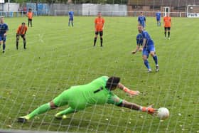 Lee Beeson nets a penalty in last season's victory over Lutterworth.