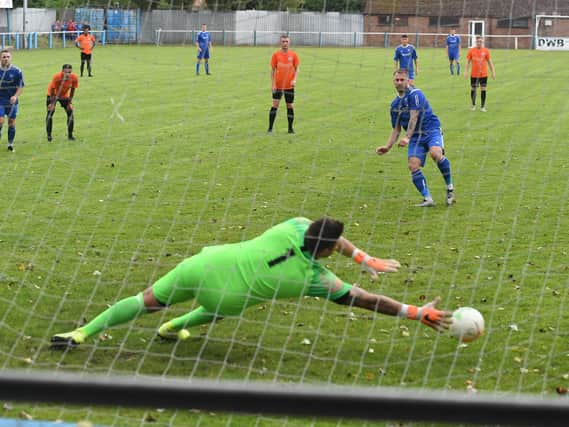 Lee Beeson nets a penalty in last season's victory over Lutterworth.